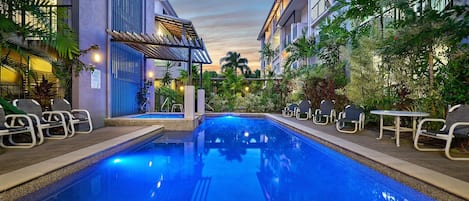 Outdoor pool, open 7:00 AM to 9:00 PM, pool loungers