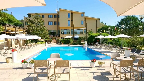 Seasonal outdoor pool, pool umbrellas, pool loungers