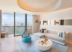Family Suite, 1 King Bed, Ocean View (Premium) | Living area | 55-inch LED TV with cable channels, TV - Hilton Pattaya (Pattaya)