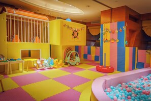 A brightly colored indoor play area with a ball pit, play structures, and a soft play floor. - InterContinental Hangzhou ICC by IHG (Hangzhou)