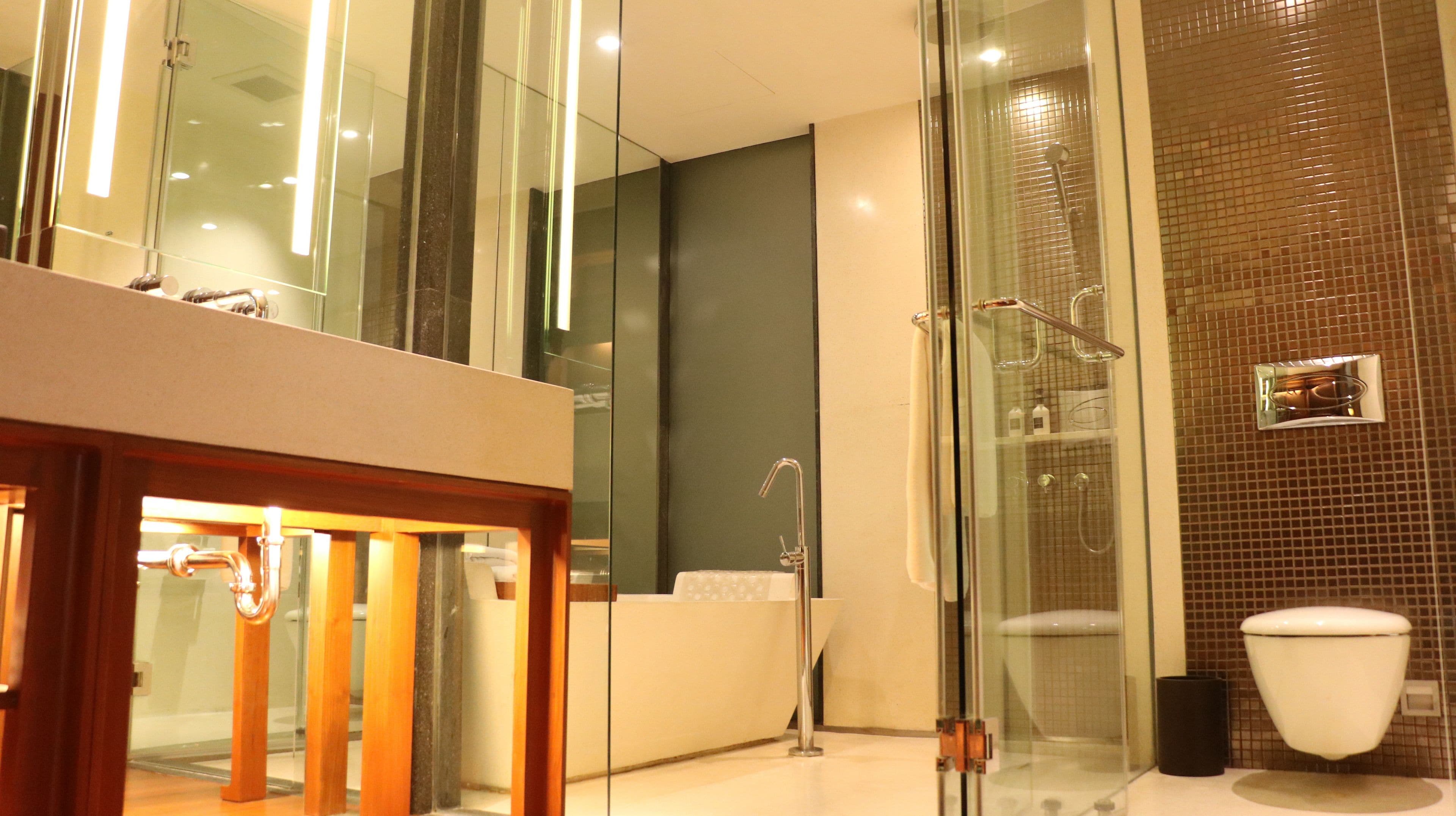 edge suite | bathroom | separate bathtub and shower, rainfall showerhead, free toiletries