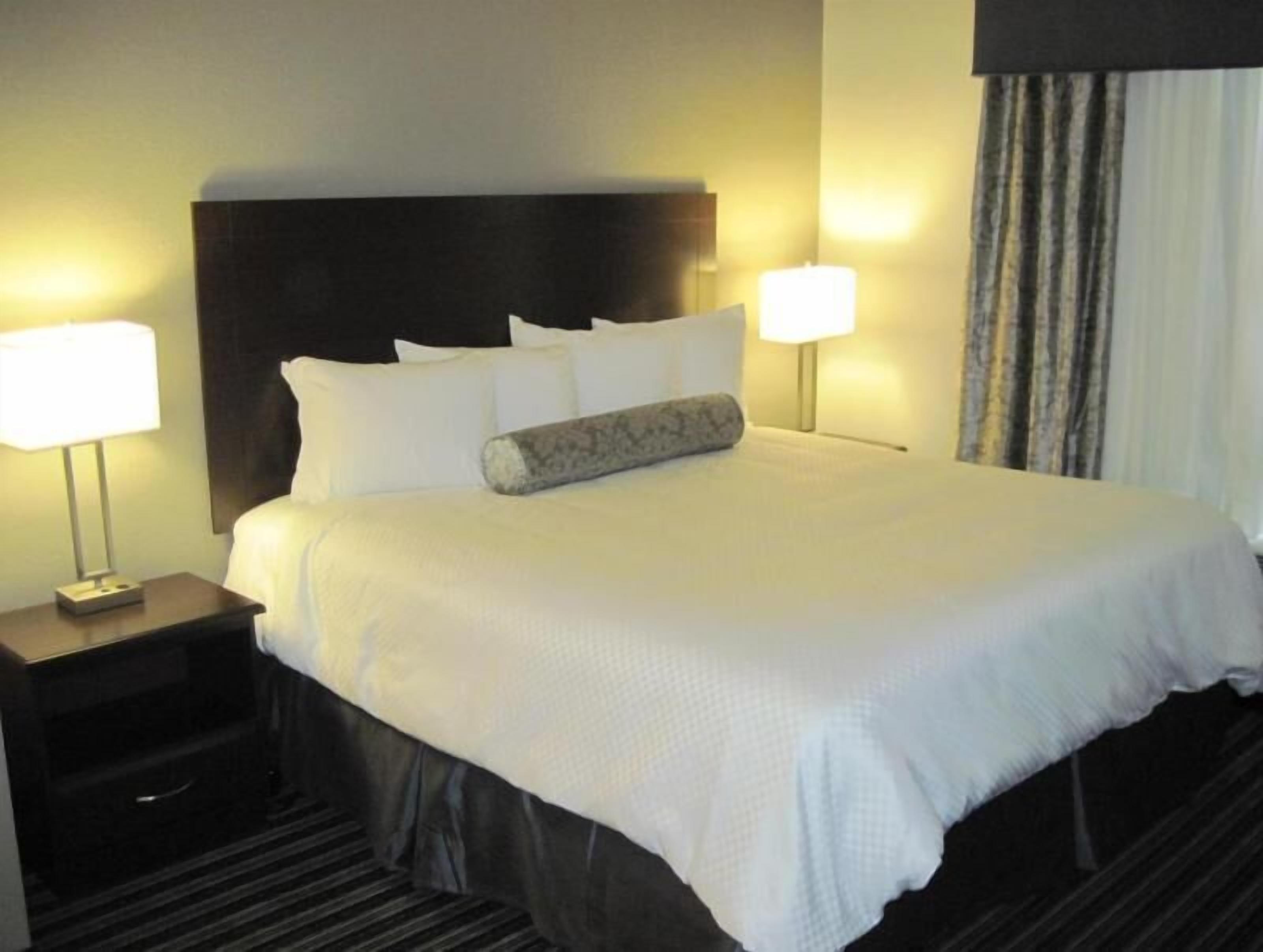 Premium bedding, pillow-top beds, desk, blackout curtains
