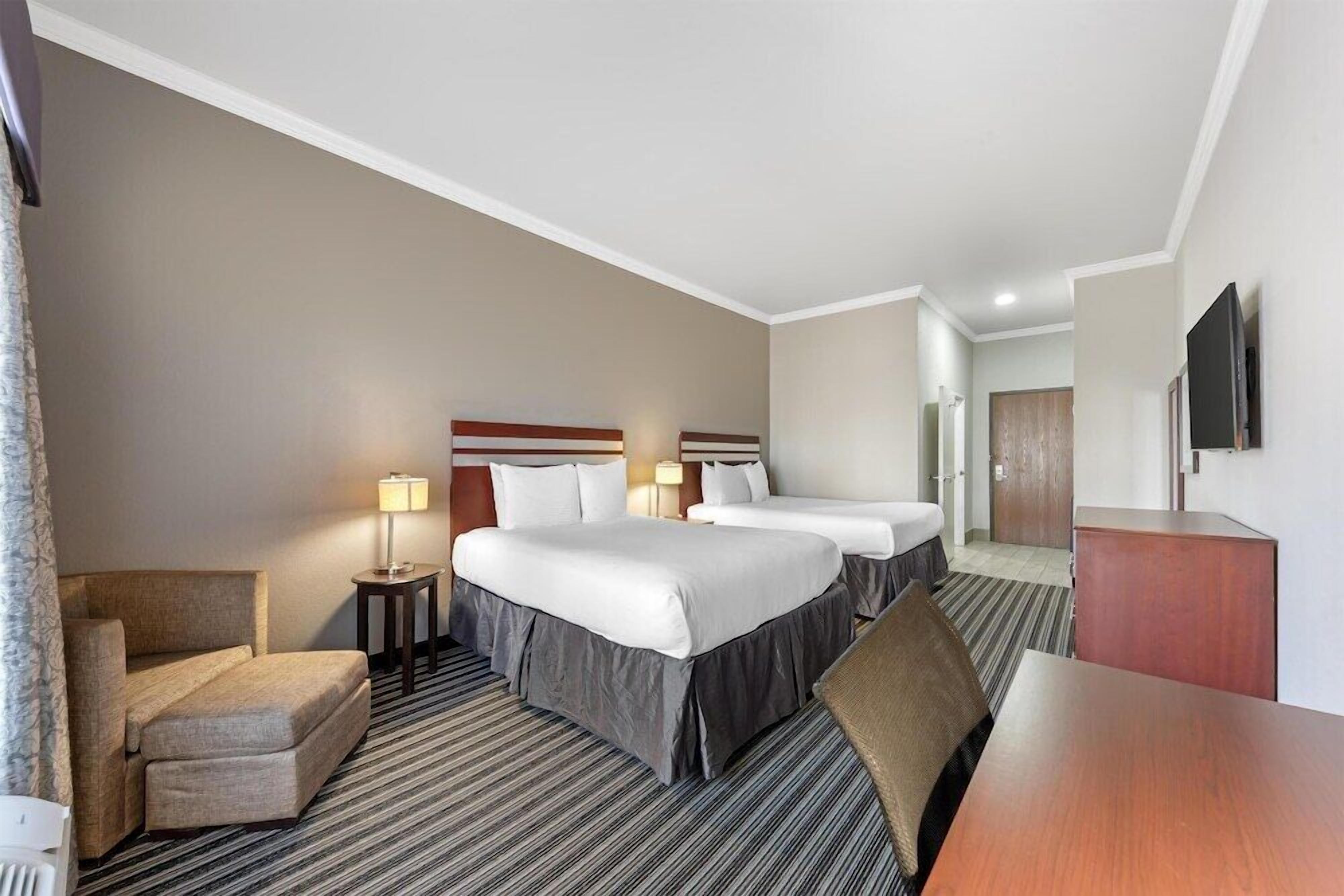 Premium bedding, pillow-top beds, desk, blackout curtains