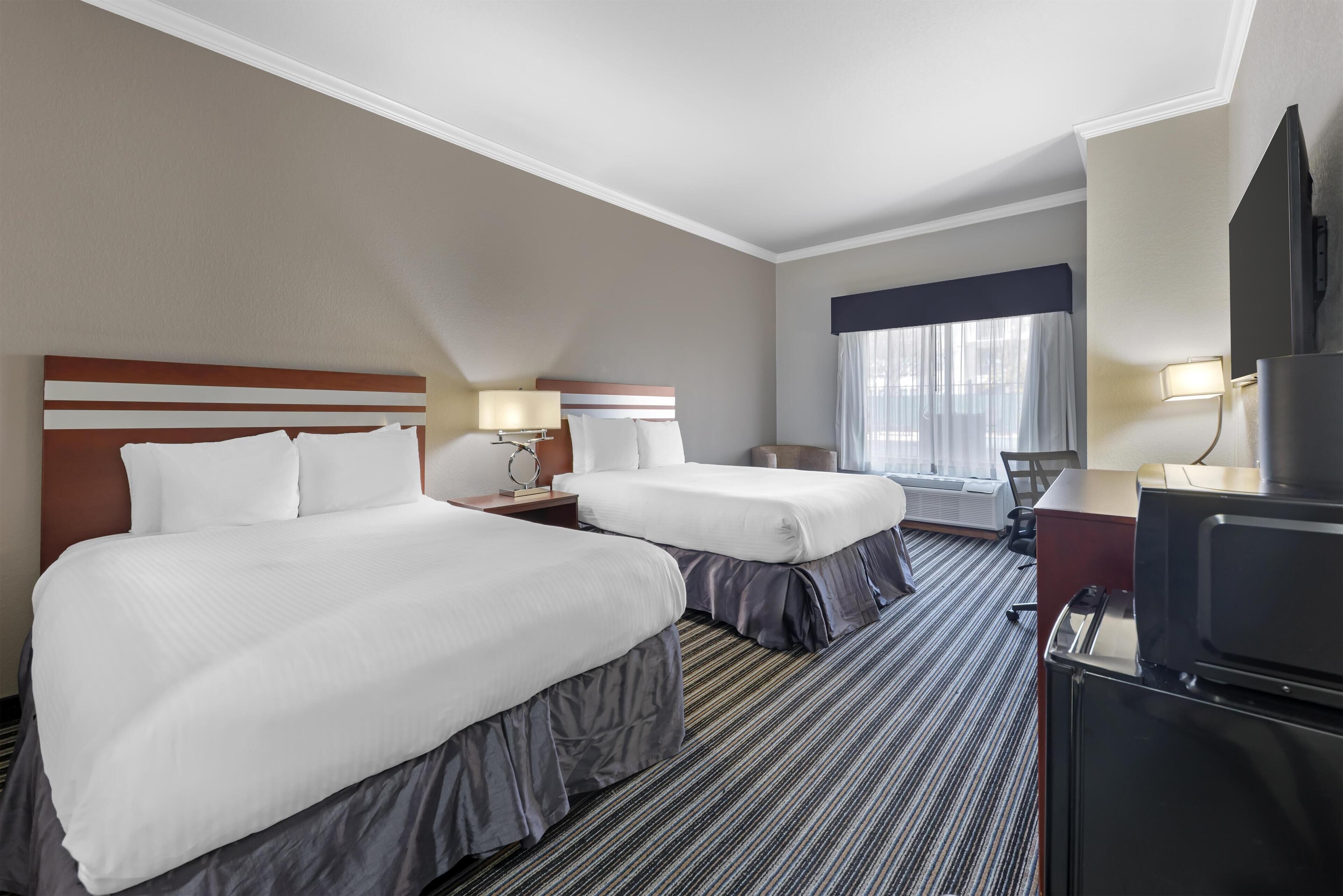 Premium bedding, pillowtop beds, desk, blackout drapes