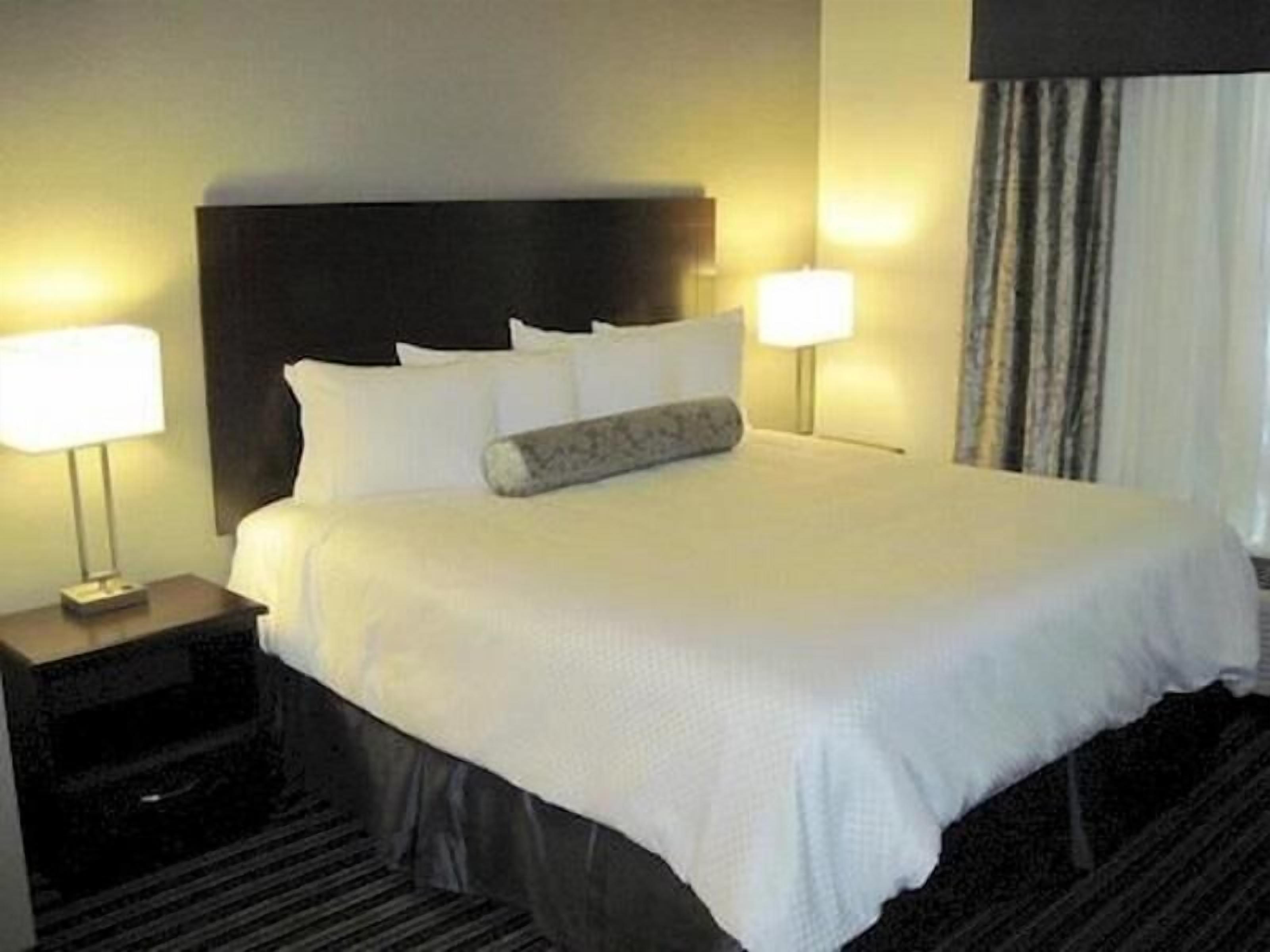Premium bedding, pillow-top beds, desk, blackout curtains