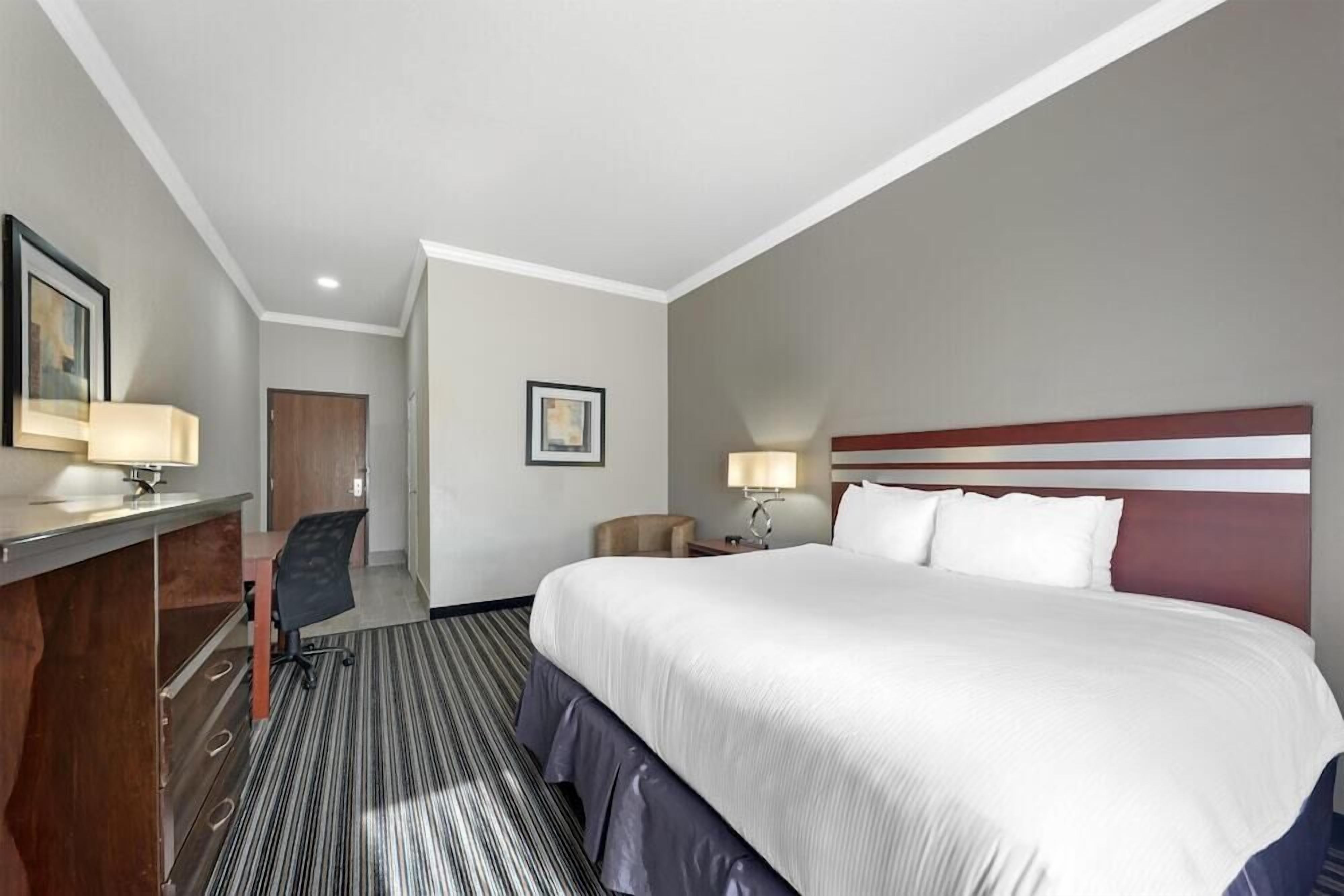 Premium bedding, pillow-top beds, desk, blackout curtains