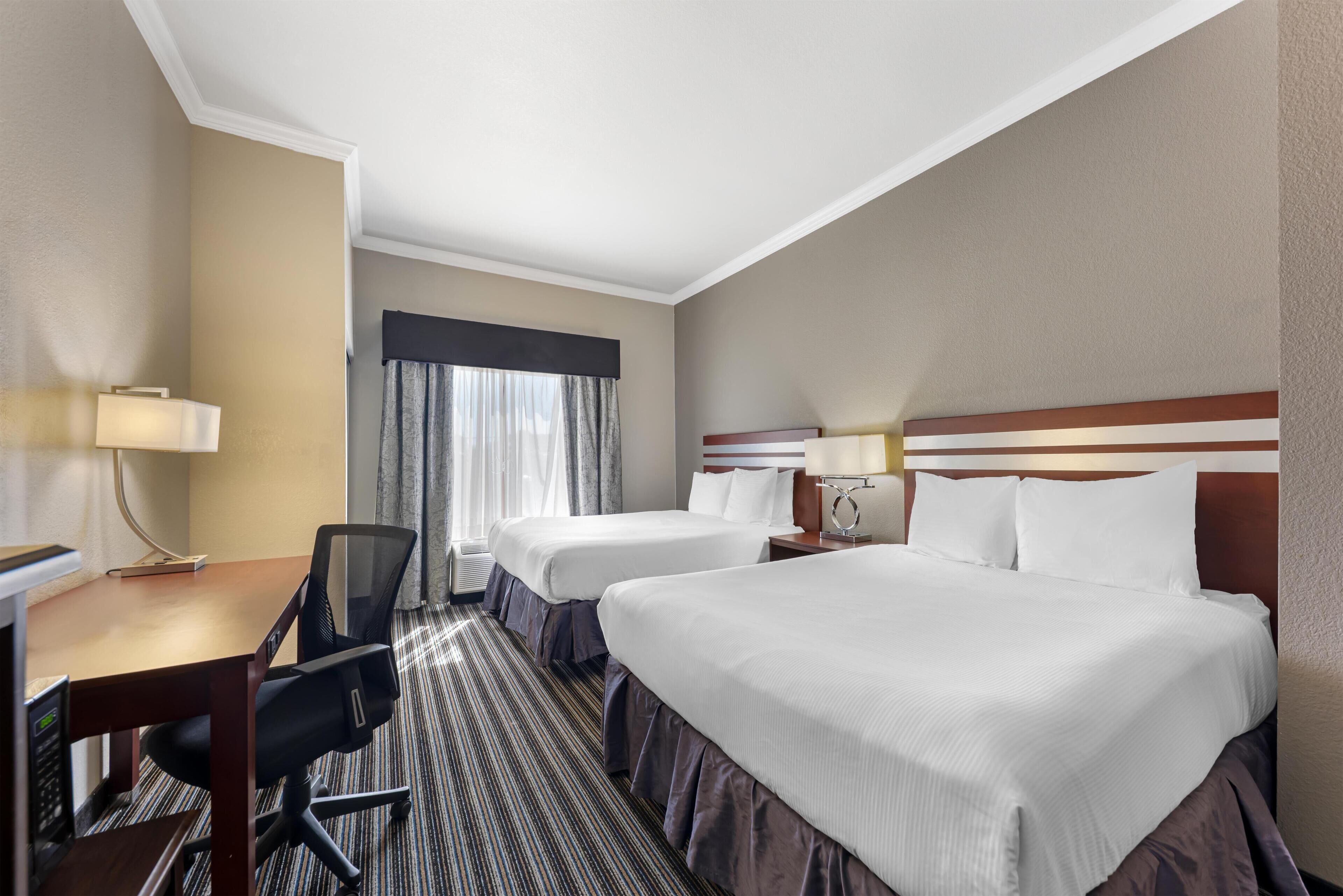 Premium bedding, pillowtop beds, desk, blackout drapes