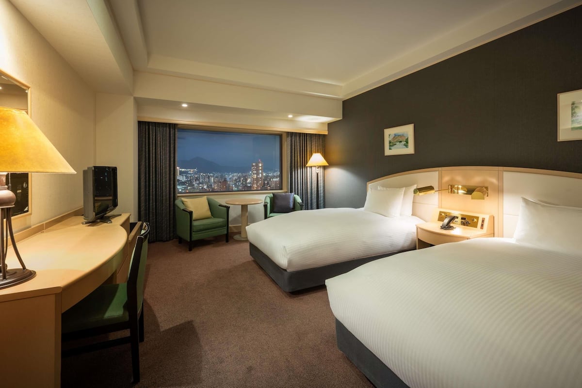 Superior Junior Suite with 2 single beds, City side | In-room safe, desk, blackout drapes, iron/ironing board