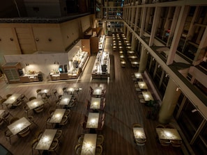 A spacious hotel lobby with multiple dining areas, a central bar, and a high ceiling. - Grand Mercure Sapporo Odori Park (Sapporo)