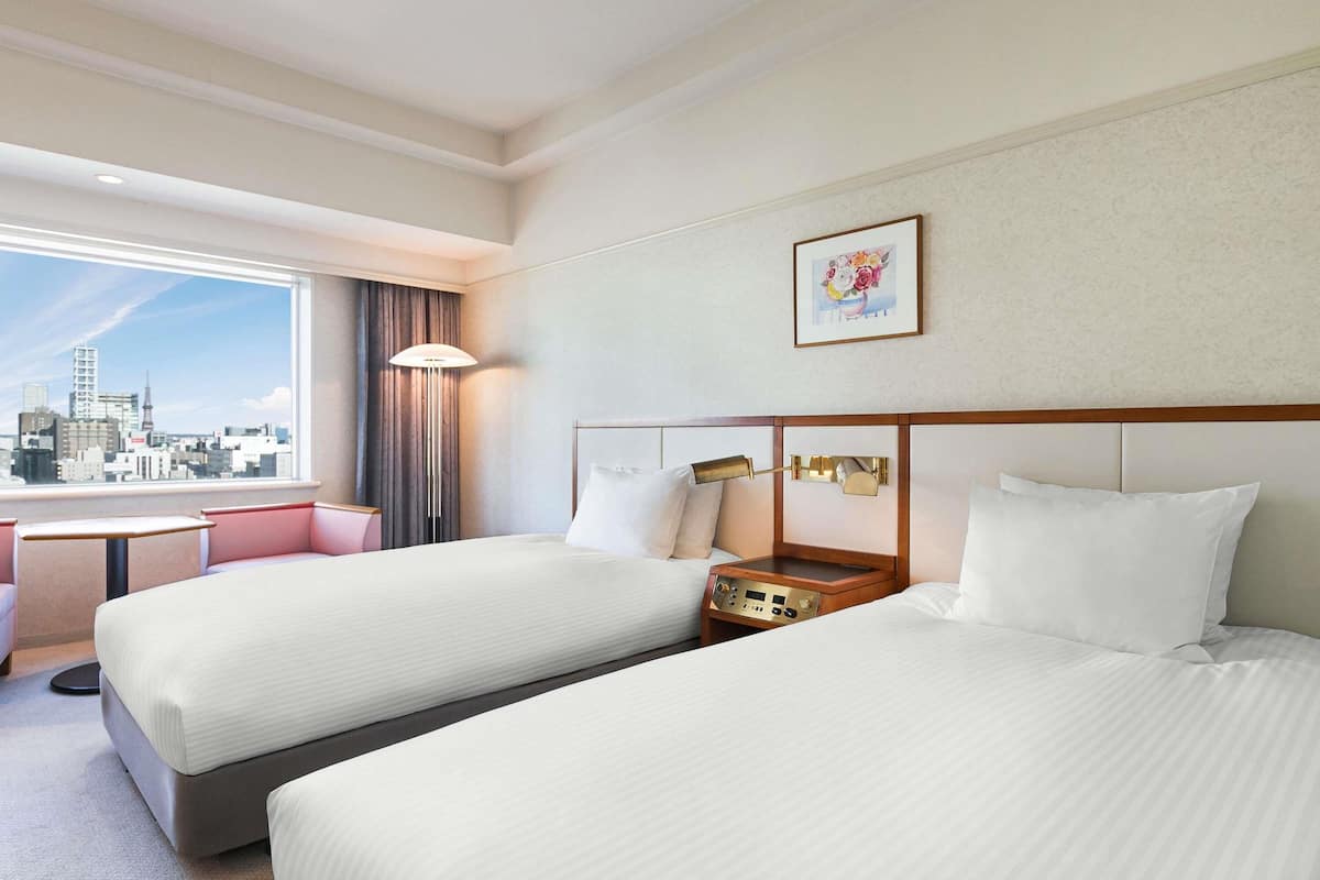 Classic Room with 2 single beds, City side | In-room safe, desk, blackout drapes, iron/ironing board