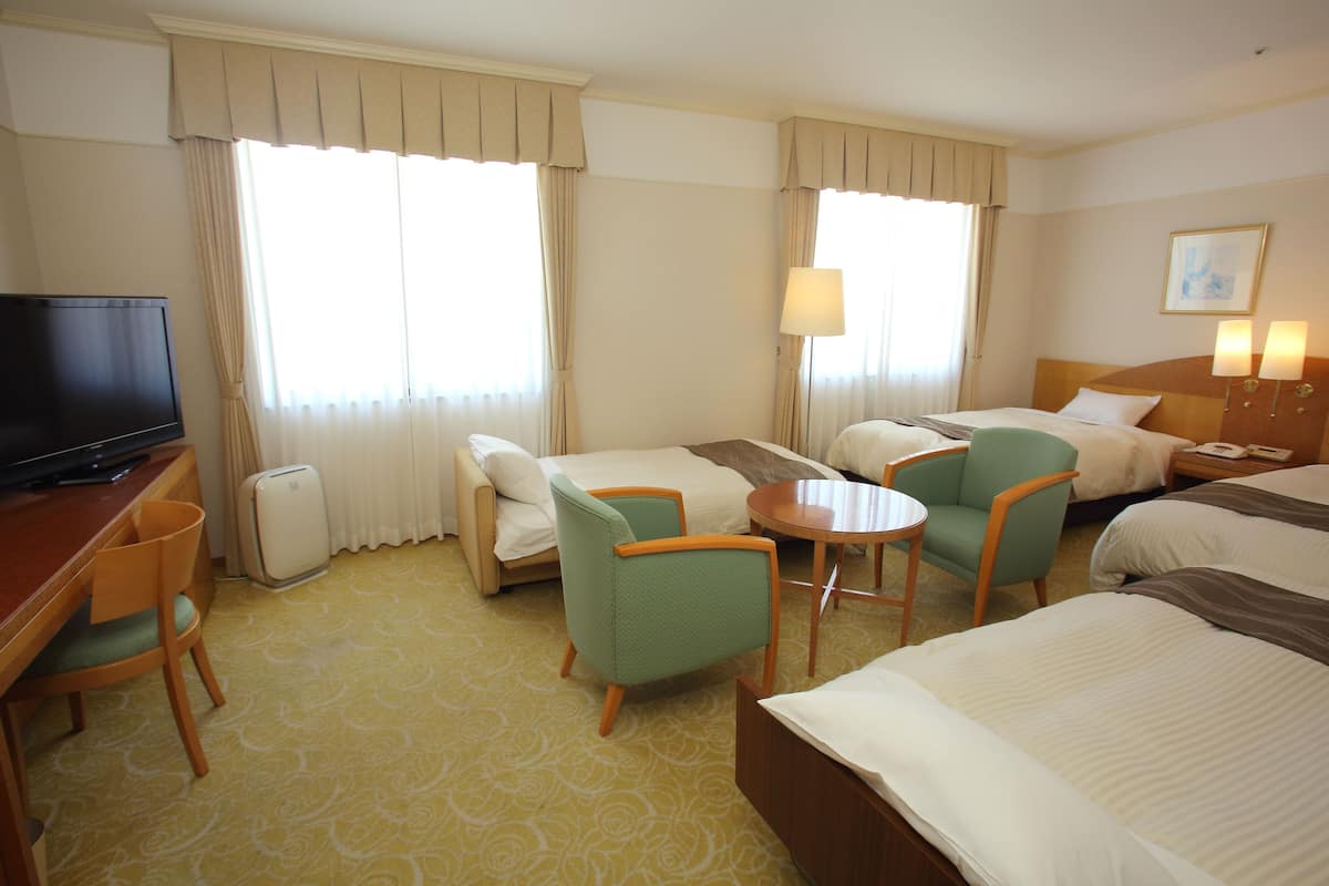Quadruple Room | 1 bedroom, in-room safe, desk, blackout drapes