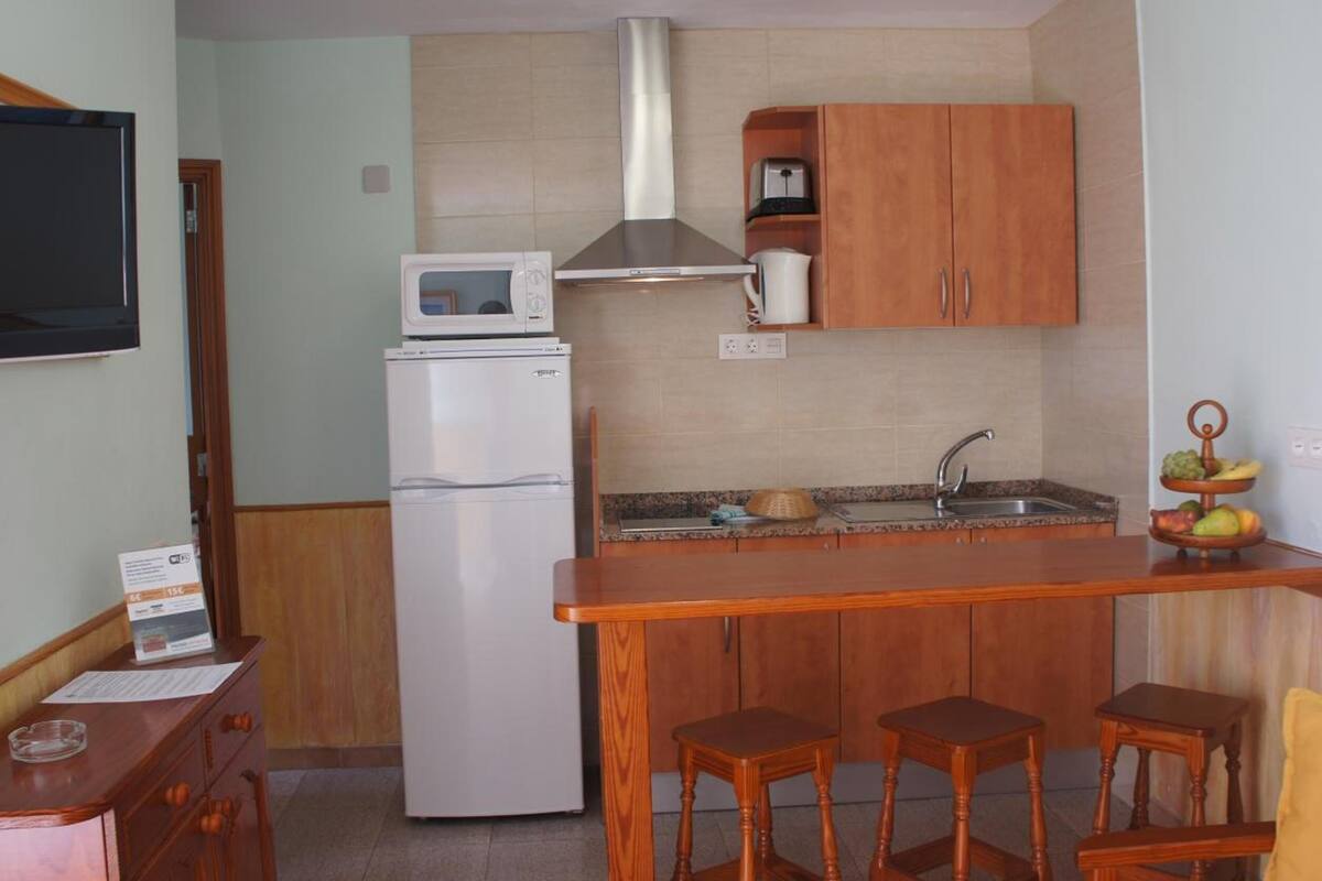 full-sized fridge, microwave, coffee/tea maker, electric kettle