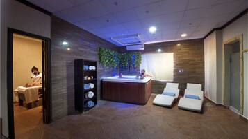 Relax in our spa area, featuring a hot tub and lounge chairs.