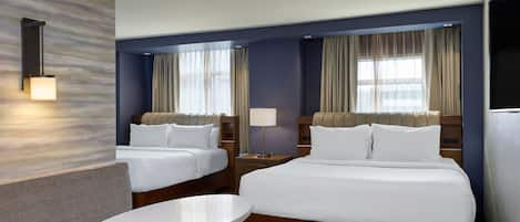 Premium bedding, down duvets, pillow-top beds, in-room safe