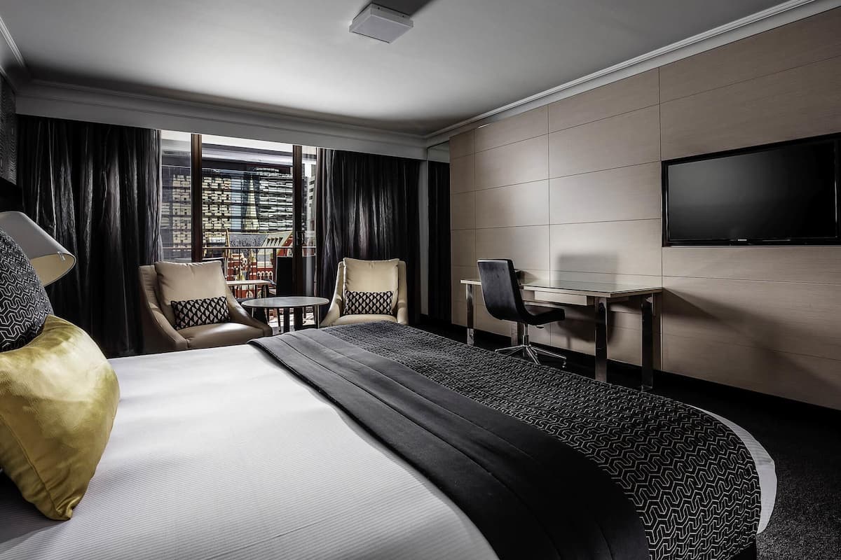 Deluxe Room, 1 King Bed, Balcony | In-room safe, desk, laptop workspace, blackout drapes