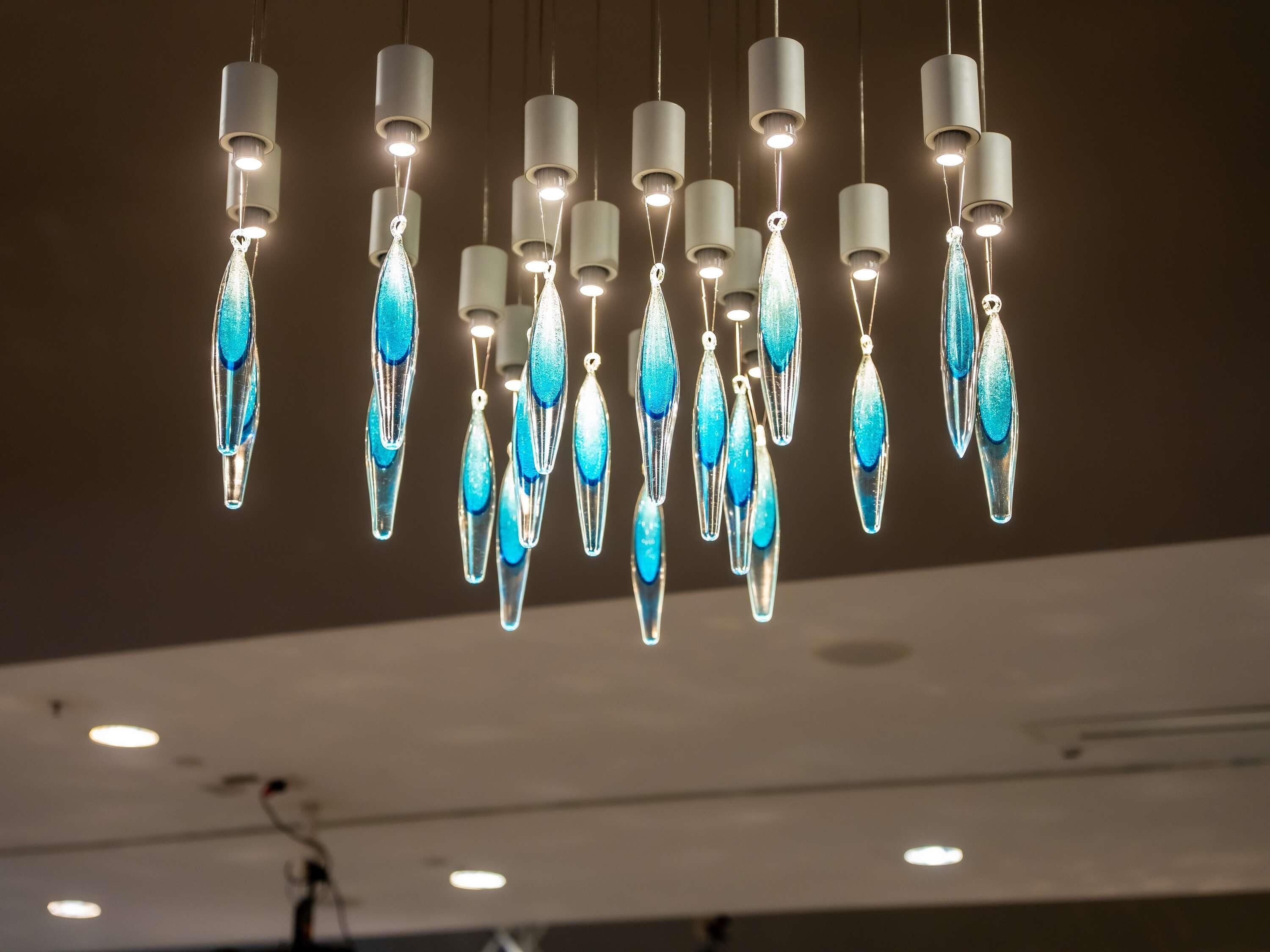 A ceiling with multiple hanging light fixtures.