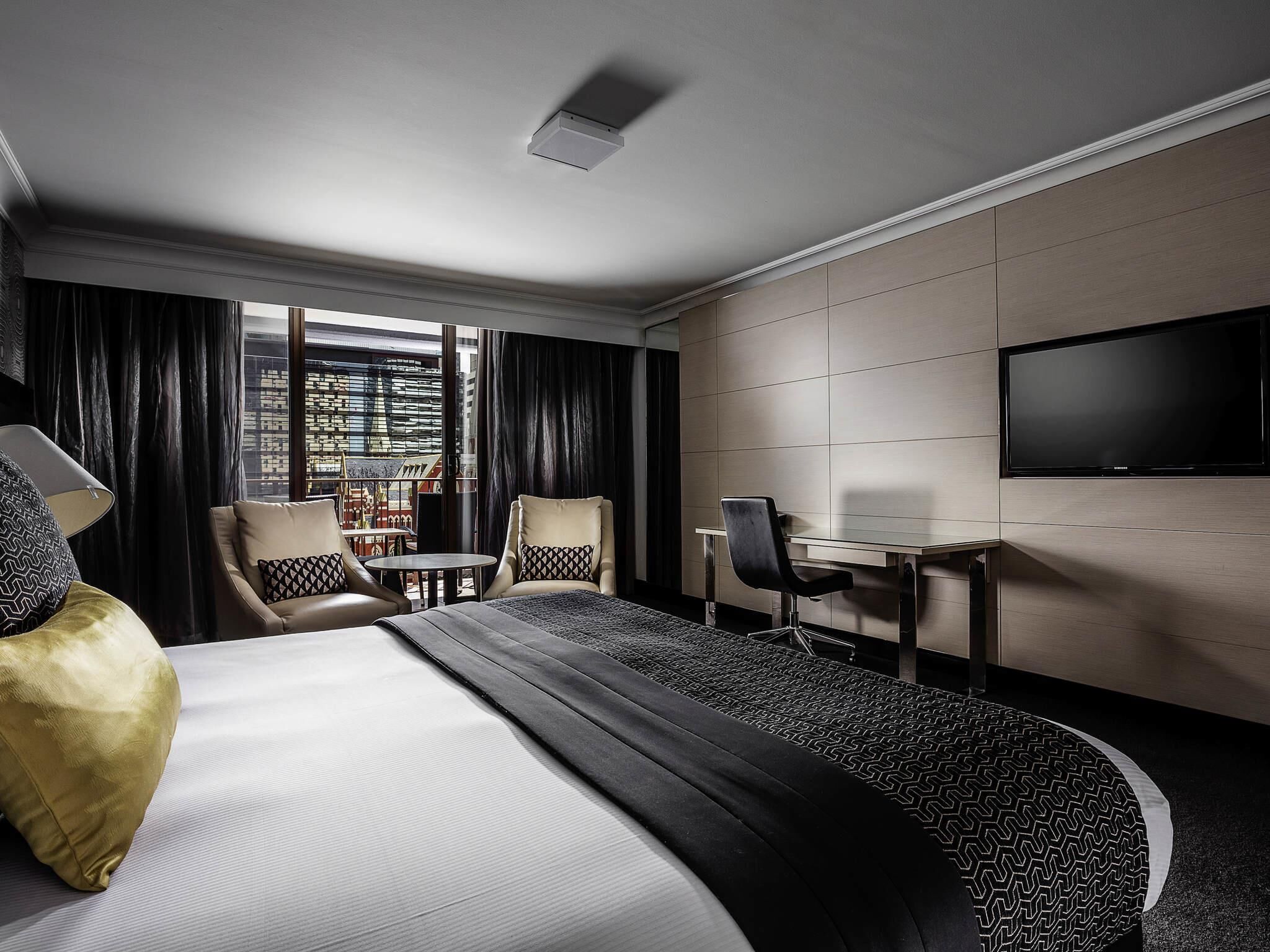 Deluxe Room, 1 King Bed, Balcony | In-room safe, desk, laptop workspace, blackout drapes