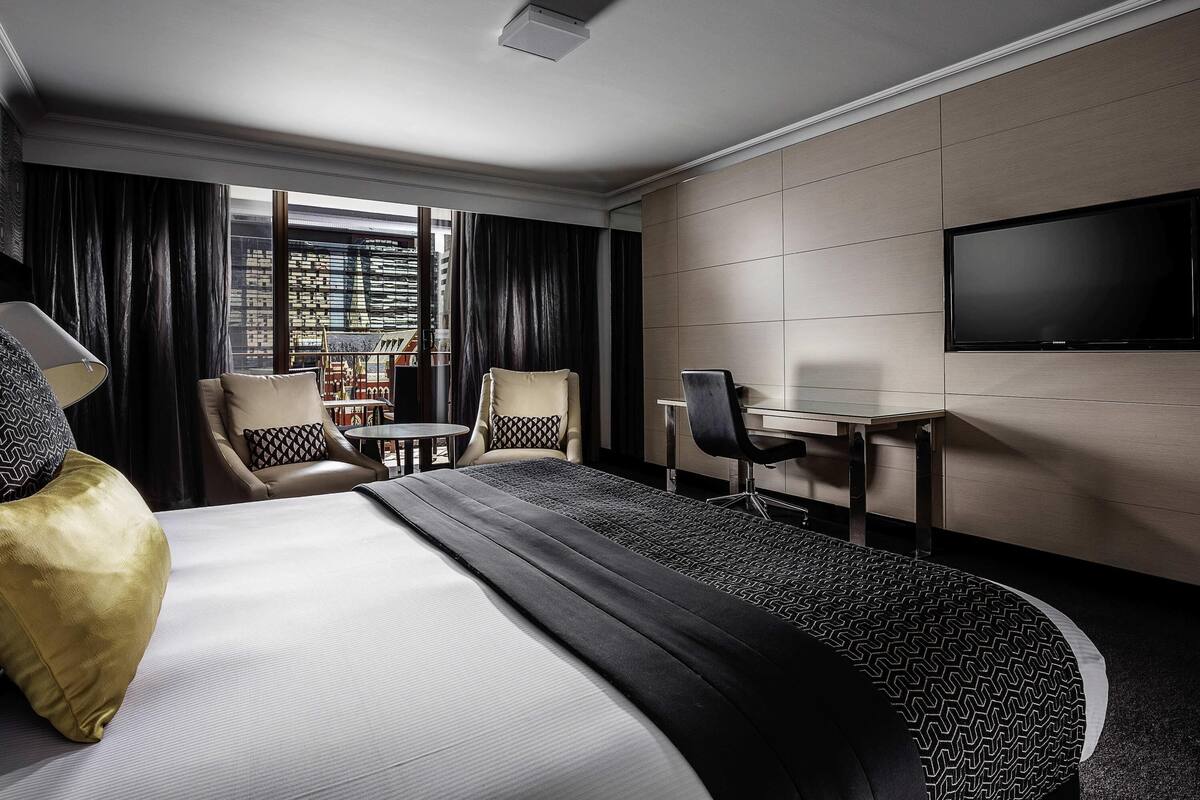 Deluxe Room, 1 King Bed, Balcony | In-room safe, desk, laptop workspace, blackout drapes