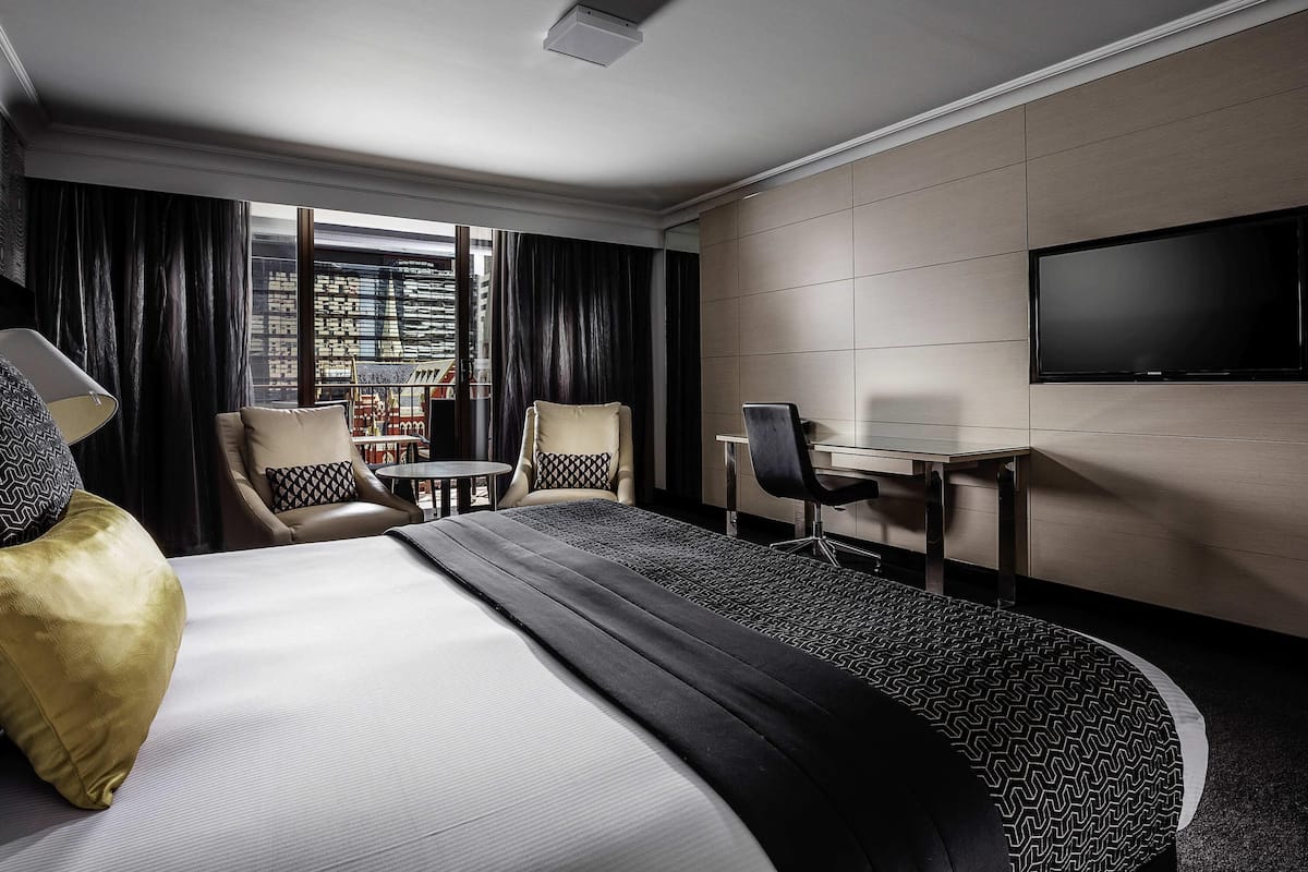 Deluxe Room, 1 King Bed, Balcony | In-room safe, desk, laptop workspace, blackout drapes