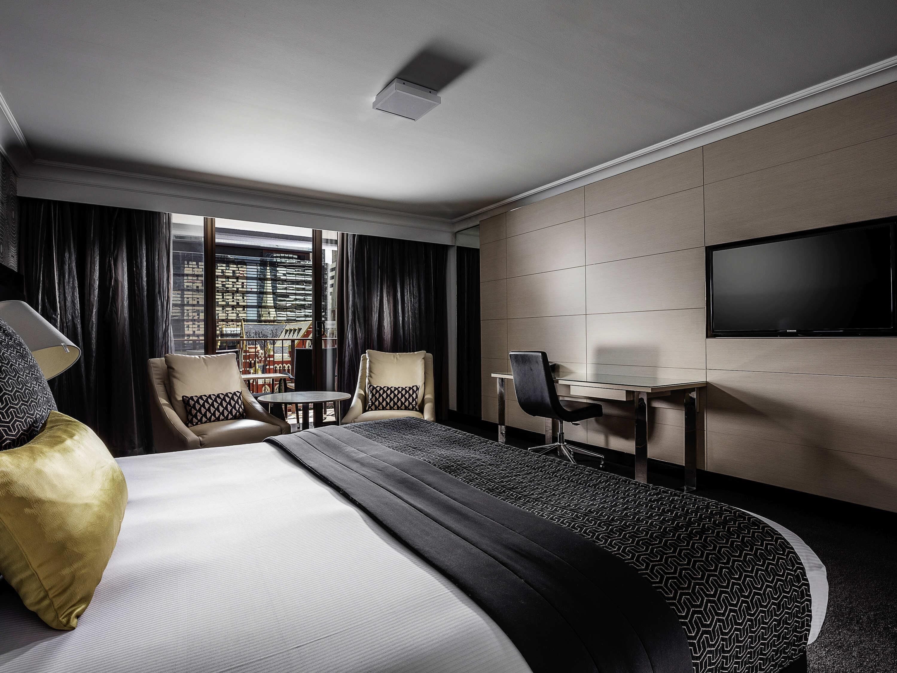 Deluxe Room, 1 King Bed, Balcony | In-room safe, desk, laptop workspace, blackout drapes