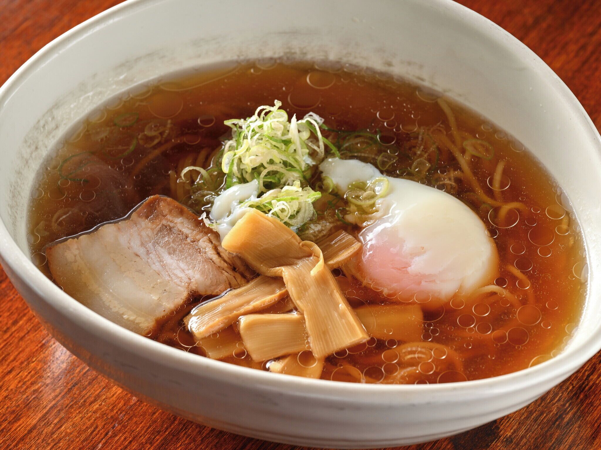 A bowl of ramen with various toppings.