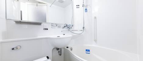 A modern bathroom with a bathtub, a sink, and a shower.