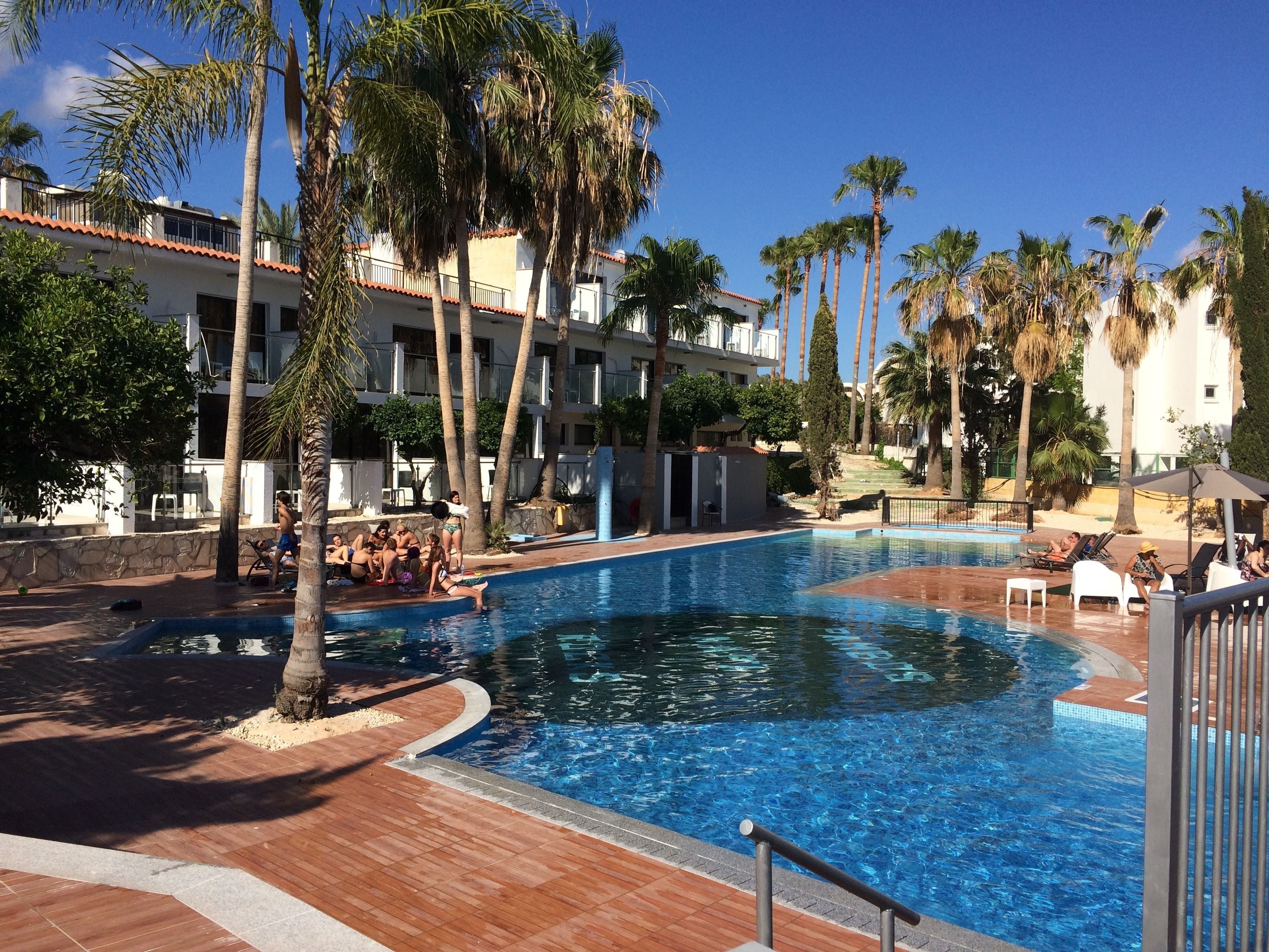 Seasonal outdoor pool, pool umbrellas, pool loungers