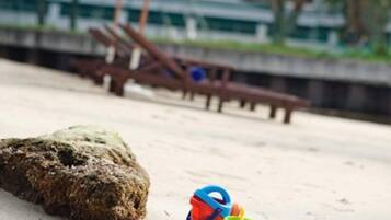 On the beach, rowing