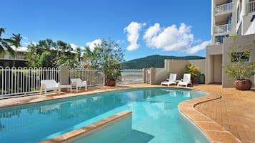 Outdoor pool, pool umbrellas, sun loungers