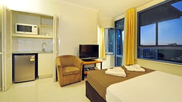 Desk, laptop workspace, blackout curtains, iron/ironing board