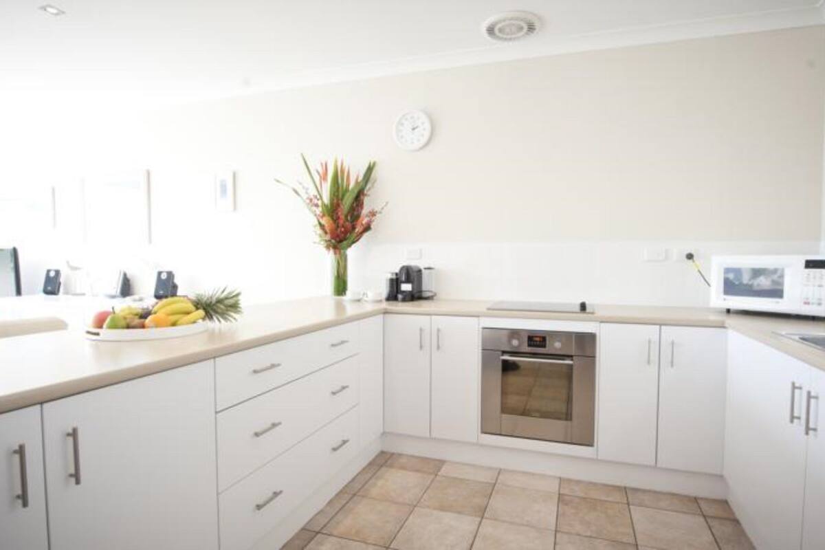 fridge, electric kettle, toaster, dining tables