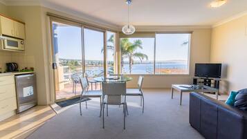 Studio, Ocean & Pool View | Living area | TV