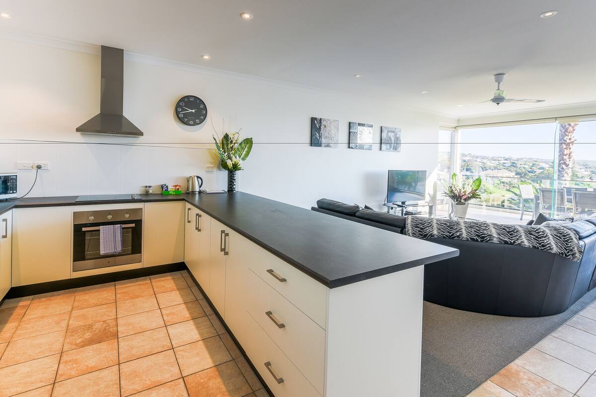 fridge, electric kettle, toaster, dining tables