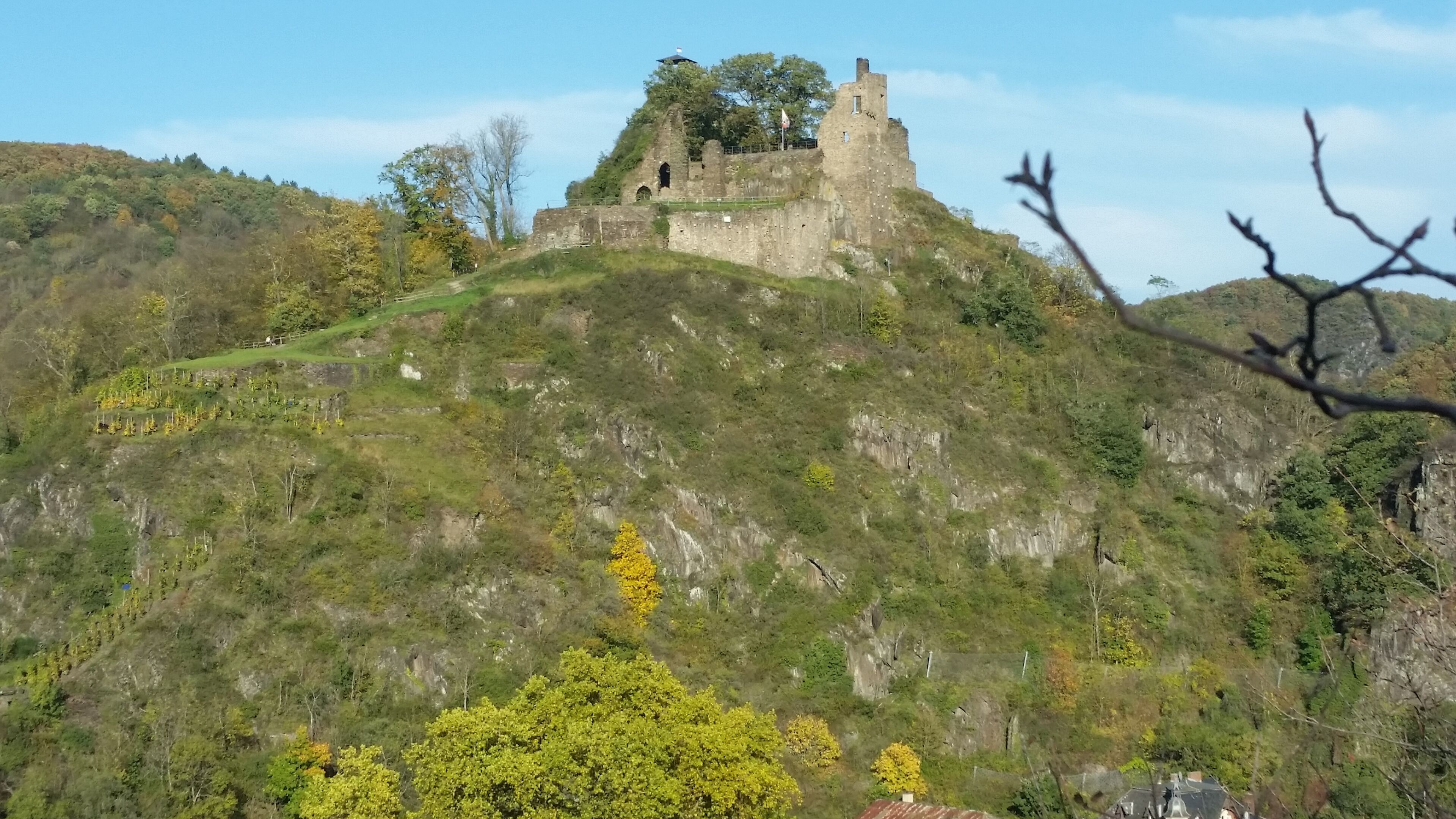 A castle on a hill with a clear sky.