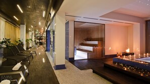 A modern hotel lobby with a reception desk, seating area, and a spa entrance. - Platinum Palace Boutique Hotel & SPA (Wroclaw)
