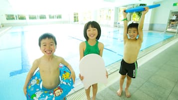 Swimmers can enjoy a refreshing dip in the pool surrounded by a spacious area.