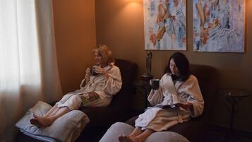 Guests can enjoy a serene spa experience with massage tables and a peaceful ambiance.