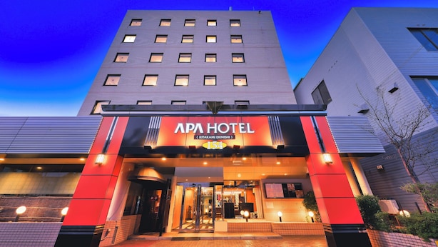 The APA Hotel entrance with a modern design, featuring a prominent red and black facade, a large entrance, and a visible address sign. - APA Hotel Kitakami Ekinishi (Kitakami)