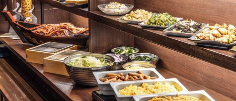 A buffet with various food items including seafood, salads, and pasta.