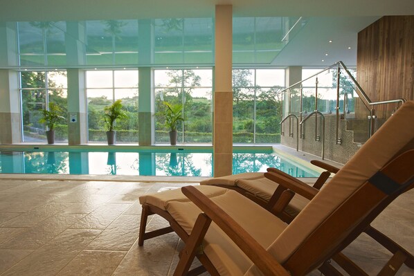 Indoor pool, open 8:00 AM to 7:30 PM, pool loungers