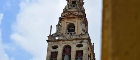 A historic tower with multiple bells and intricate architectural details.