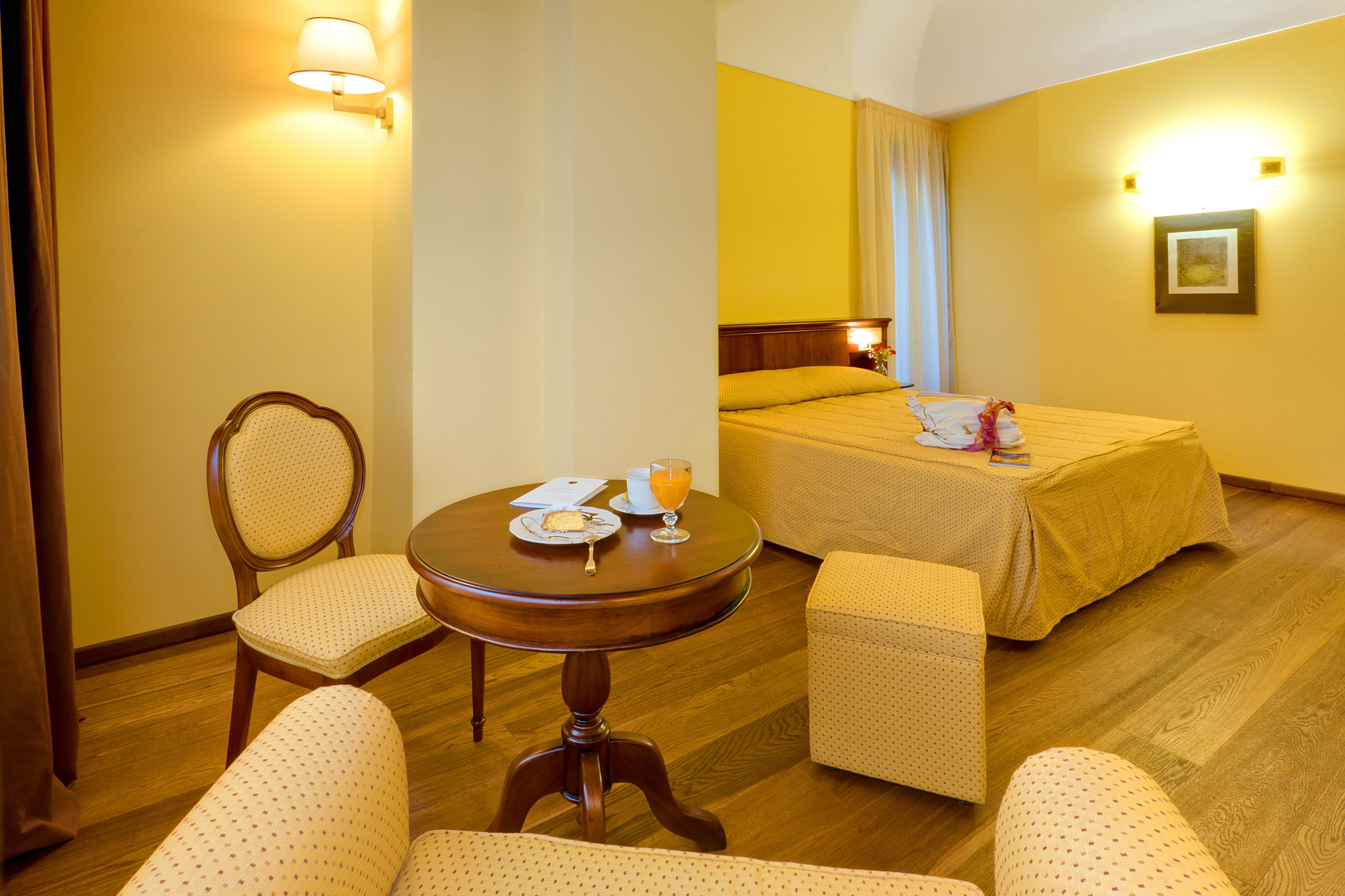 junior triple room, 1 queen bed with sofa bed, private bathroom | minibar, in-room safe, desk, soundproofing