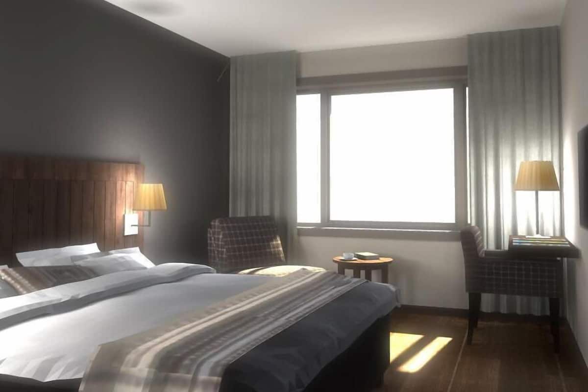 twin room | premium bedding, select comfort beds, desk, laptop workspace