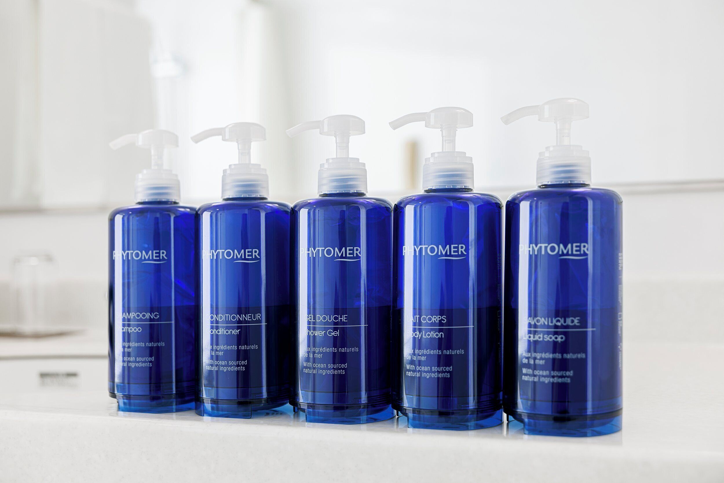 combined shower/bathtub, designer toiletries, hair dryer, slippers