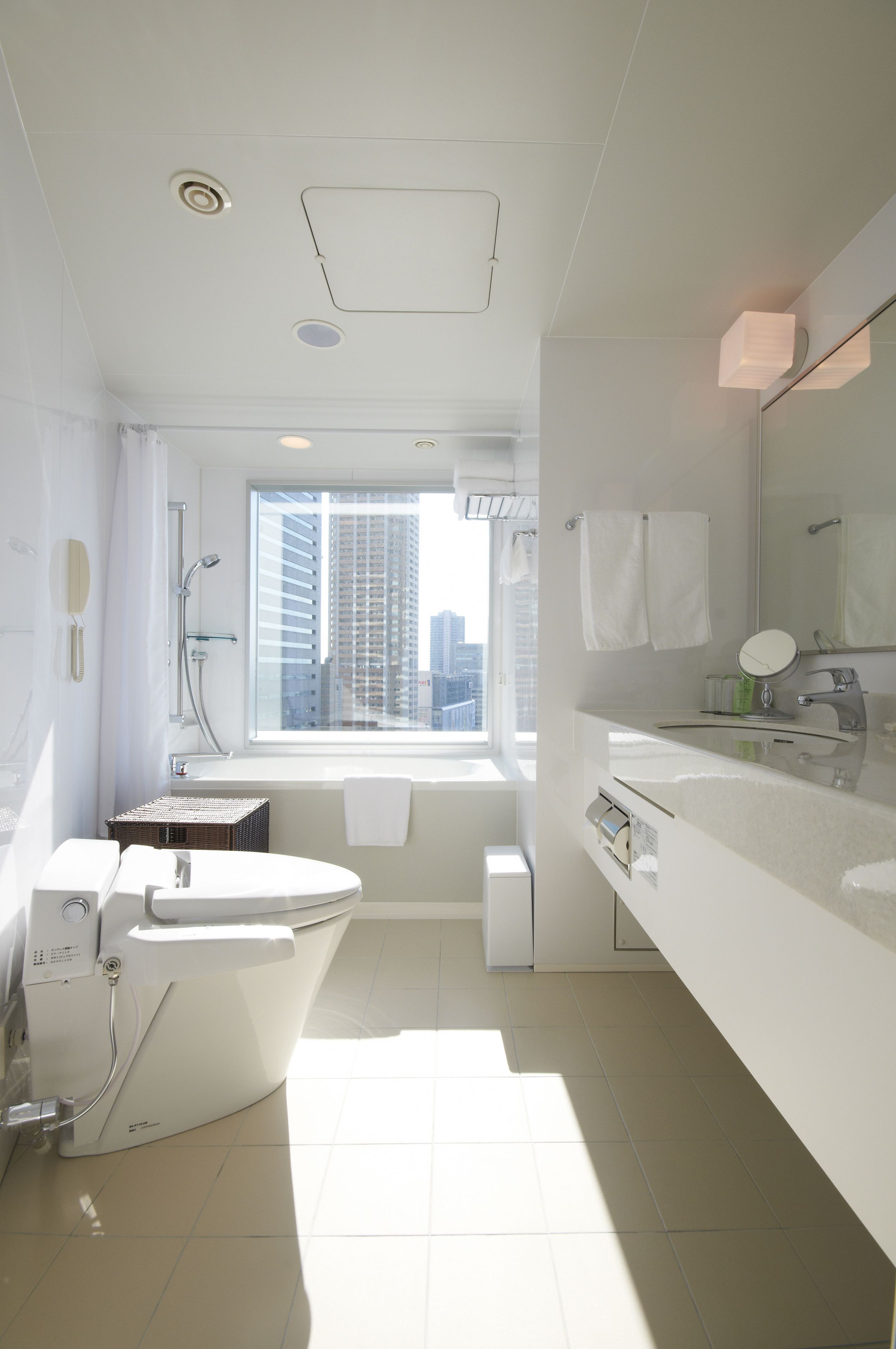 combined shower/bathtub, designer toiletries, hair dryer, slippers