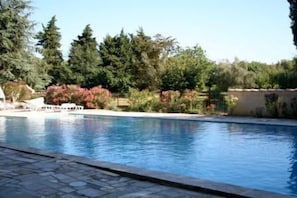 Seasonal outdoor pool, open 9:30 AM to 9:00 PM, pool umbrellas