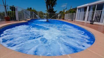 Seasonal outdoor pool, pool umbrellas, pool loungers