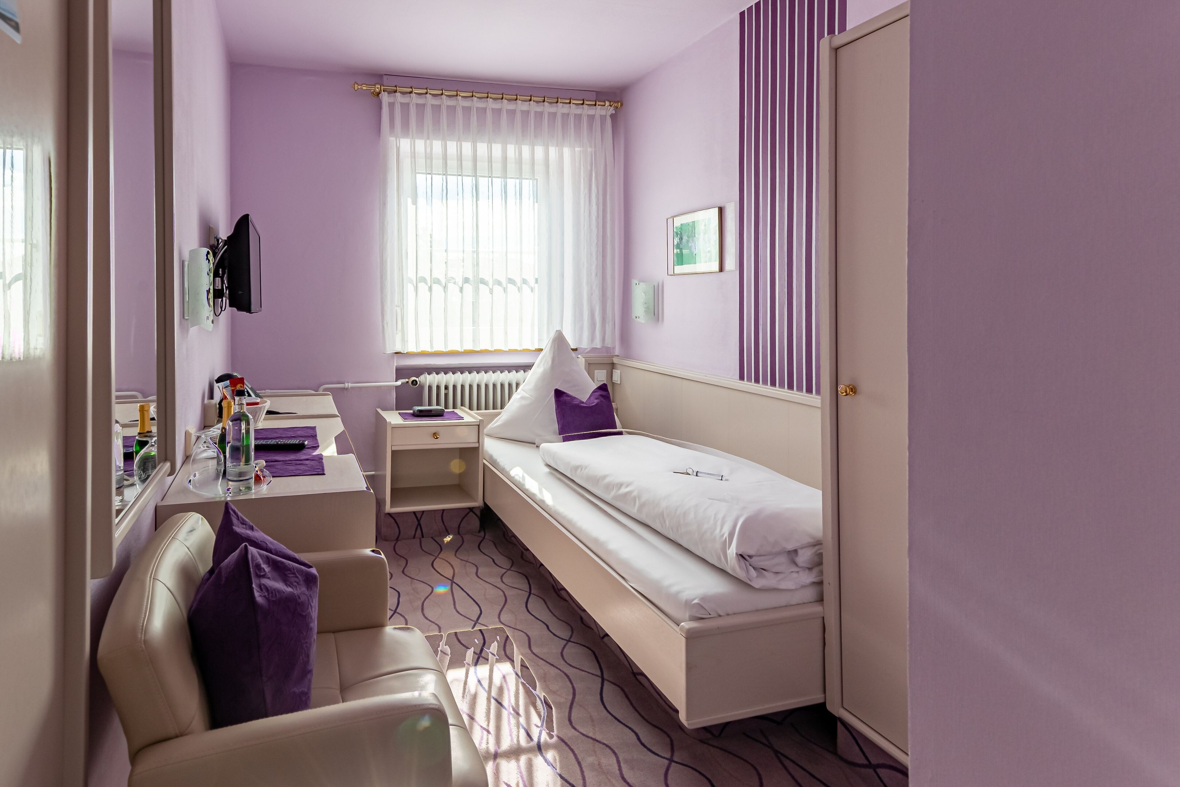 deluxe single room | in-room safe, desk, blackout curtains, iron/ironing board