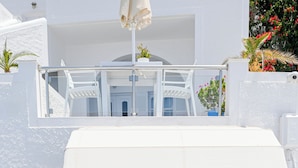 A reception area with a white canopy and a sign that reads "RECEPTION". - Kafieris Blue  (Santorini)