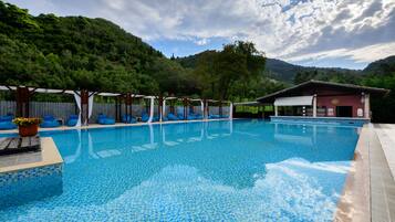 2 outdoor pools, pool umbrellas, sun loungers
